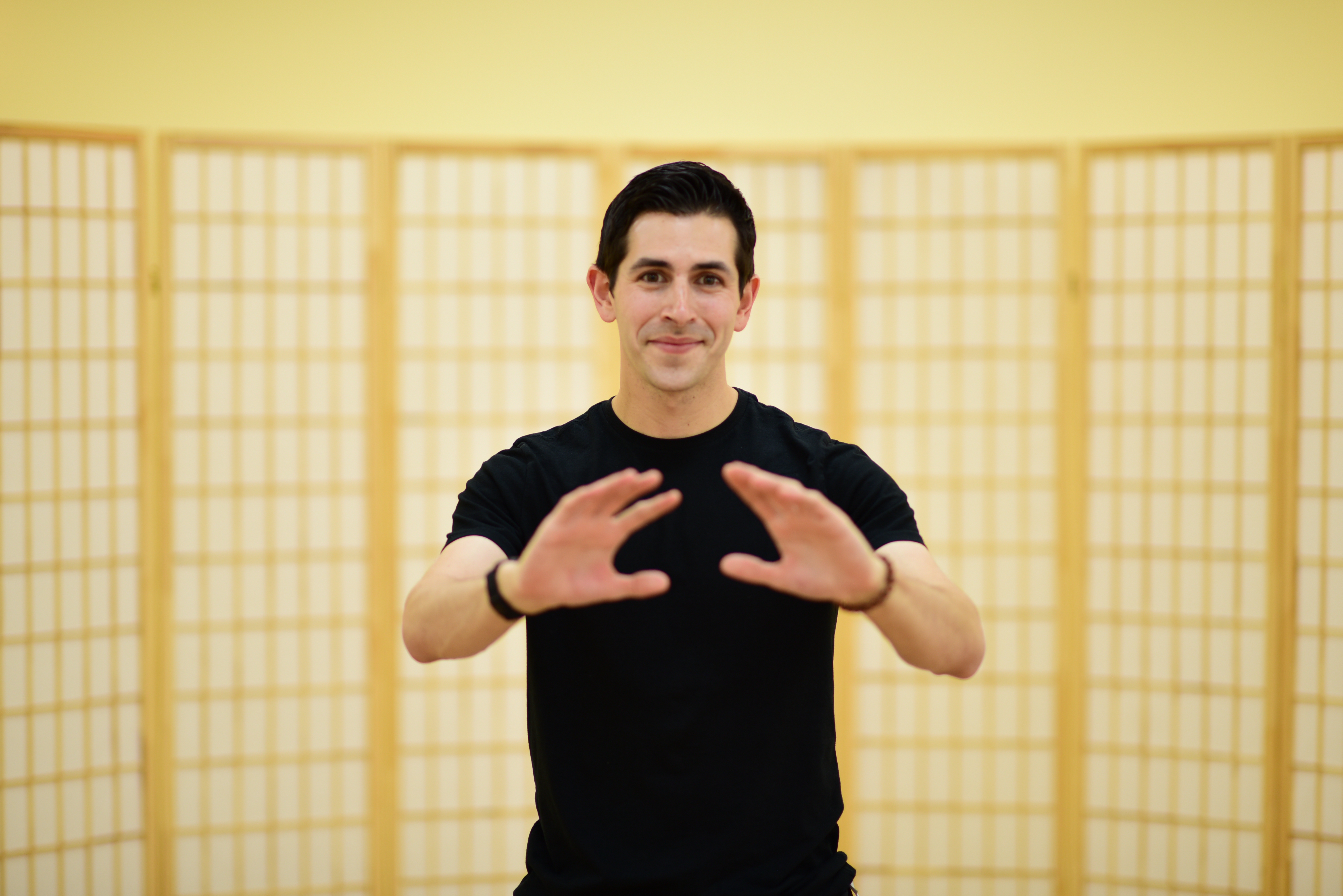 Instructor Jordan guiding tai chi